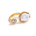 Cubic zirconia pearl geometric ring in 18K gold-plated stainless steel with pearl and cubic zirconia.