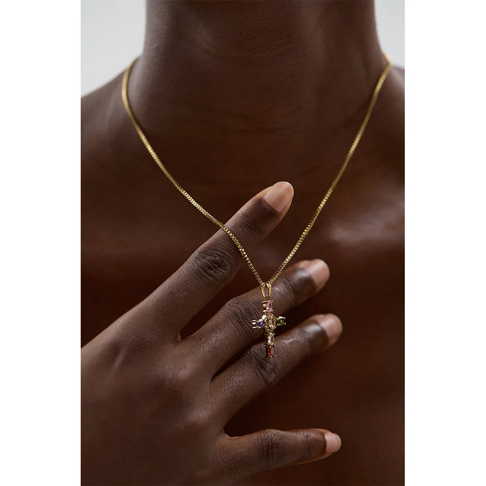 Cubic zirconia cross multi-color necklace in gold-plated stainless steel with cubic zirconia.