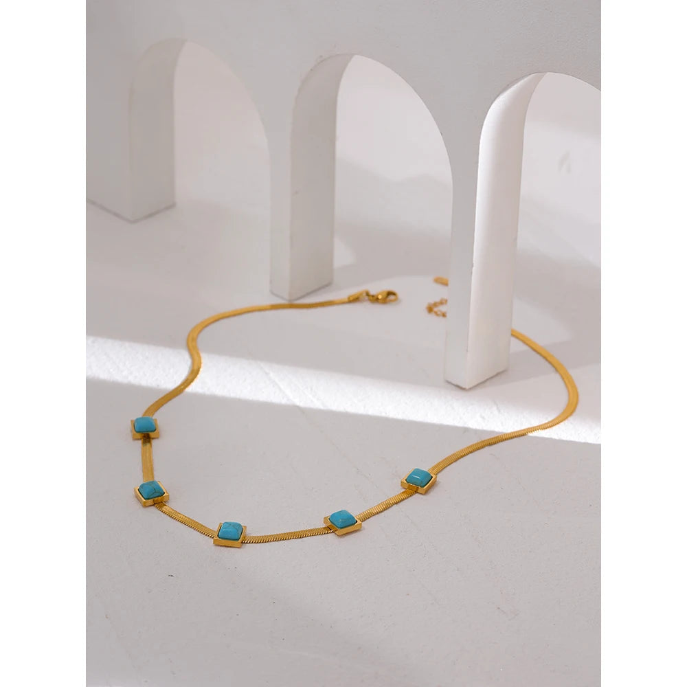 Blue natural stone snake necklace in gold-plated stainless steel with natural stone.