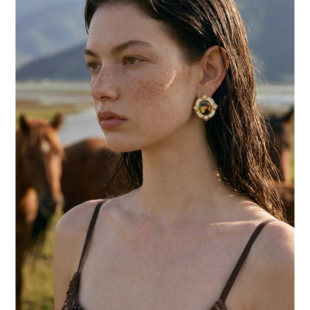 Resin crystal geometric earrings in gold-plated stainless steel with resin and crystal.