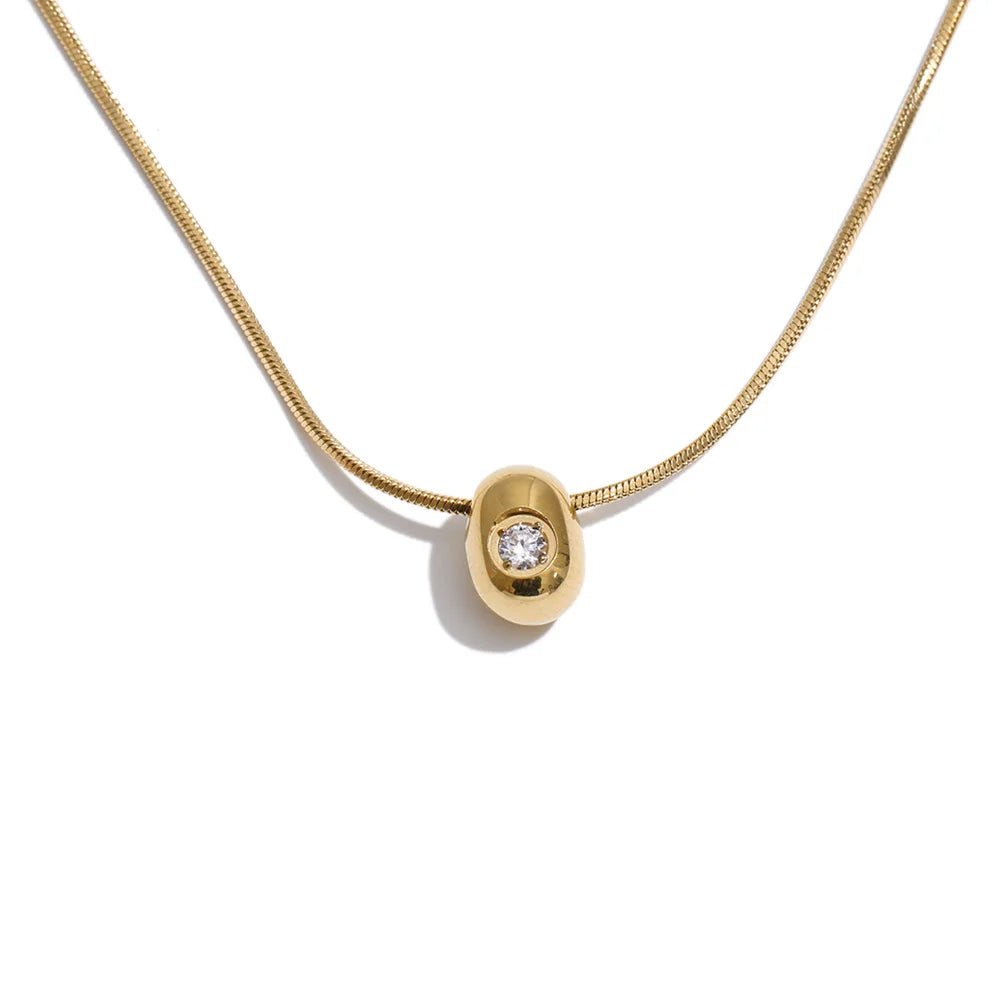 Cubic zirconia geometric necklace in gold-plated stainless steel with cubic zirconia.