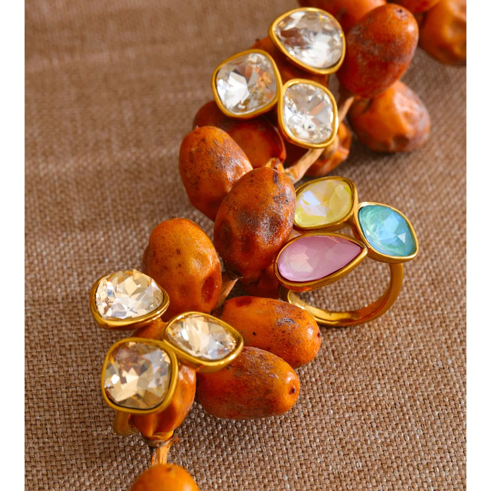 Crystal multi-color geometric ring in 18K gold-plated stainless steel with crystal.