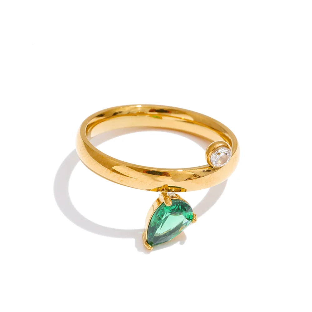 Green cubic zirconia geometric ring in 18K gold-plated stainless steel with cubic zirconia.