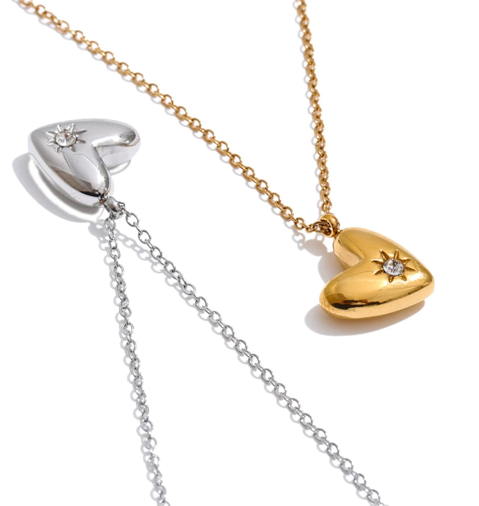 Cubic zirconia heart necklace in gold-plated stainless steel with cubic zirconia.