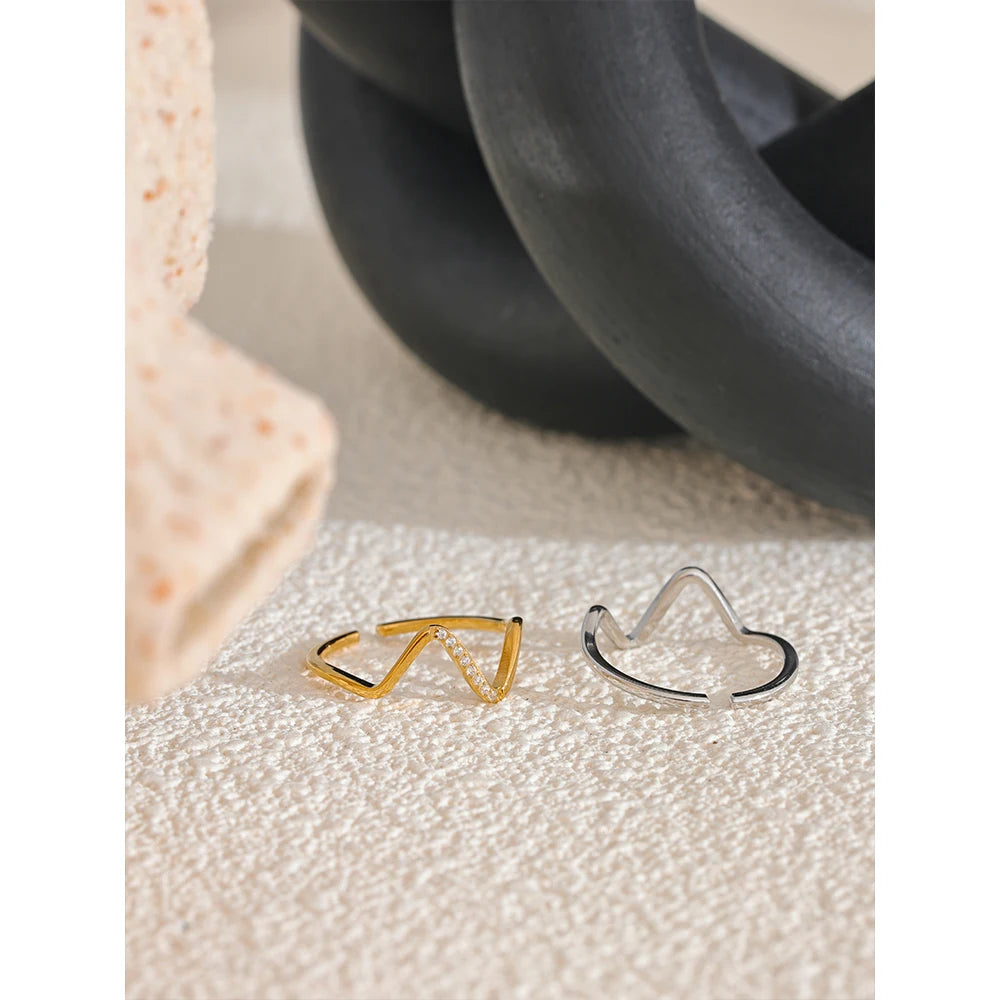 Cubic zirconia geometric ring in 18K gold-plated stainless steel with cubic zirconia.