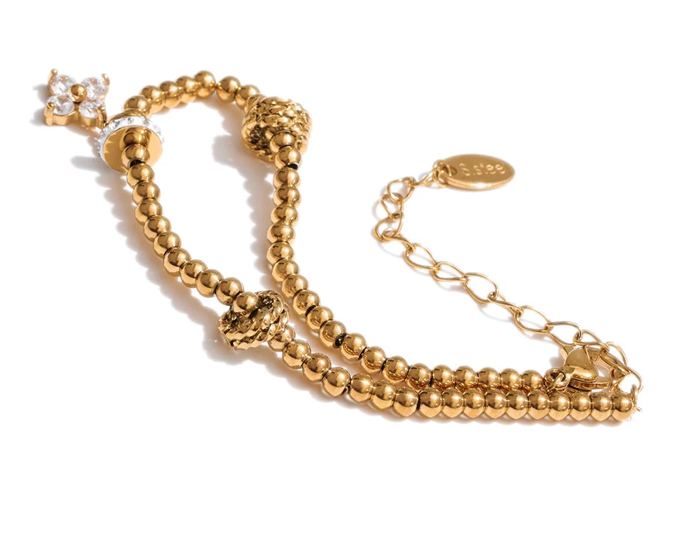 Cubic Zirconia Flower Beaded Bracelet — Gold-Plated Stainless Steel with Cubic Zirconia · PS1066