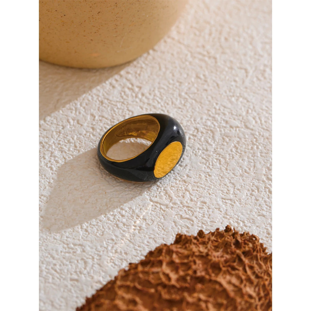 Black enamel geometric ring in gold-plated 316L stainless steel with enamel.