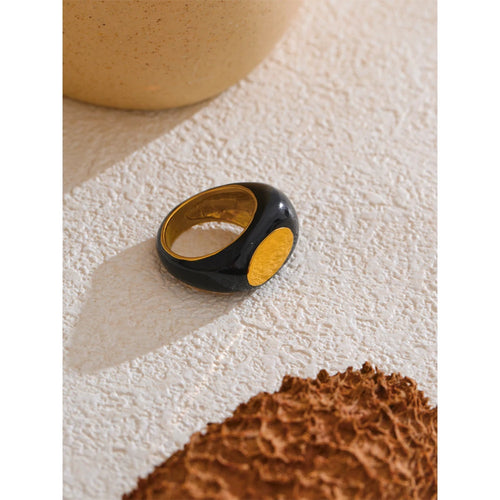 Black enamel geometric ring in gold-plated 316L stainless steel with enamel.