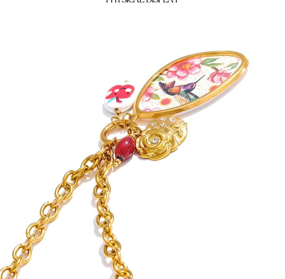 Cubic zirconia resin flower necklace in gold-plated stainless steel with cubic zirconia and resin.