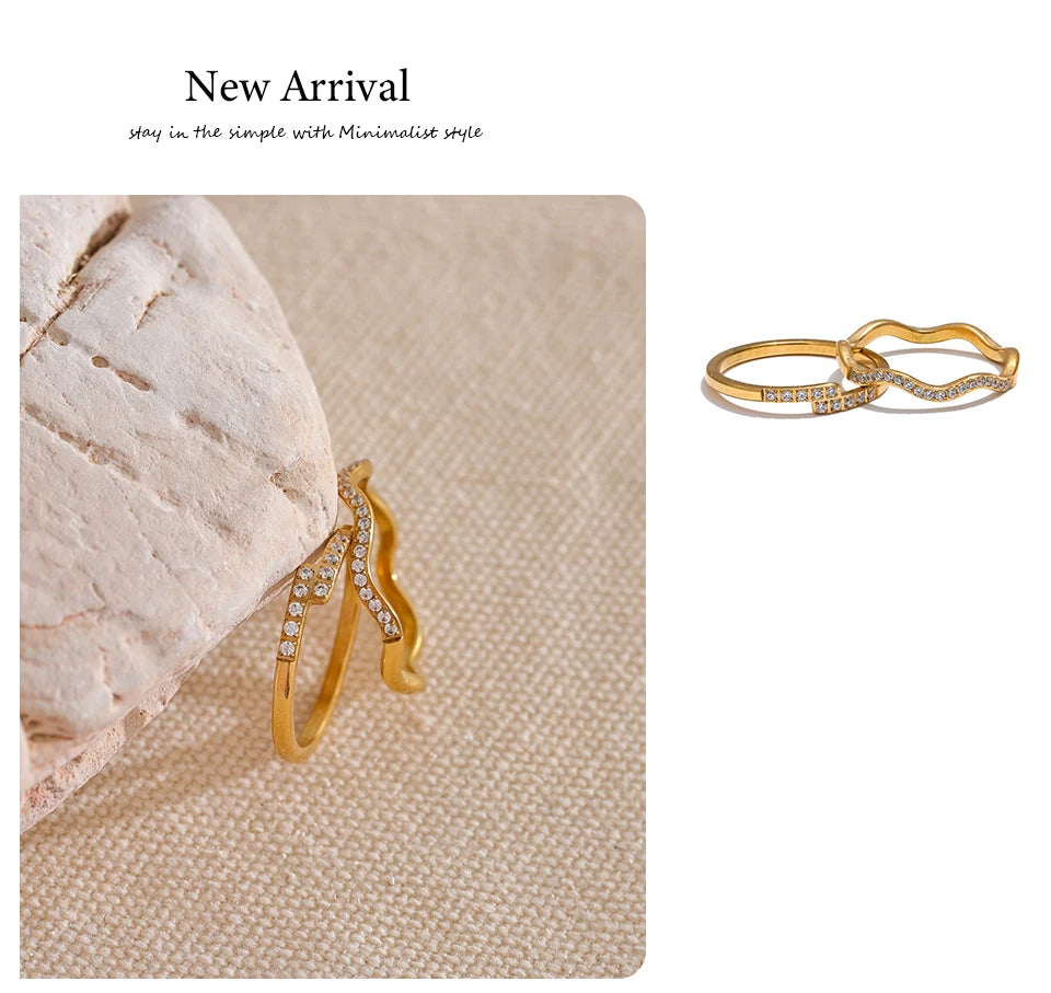 Cubic zirconia geometric ring in 18K gold-plated stainless steel with cubic zirconia.