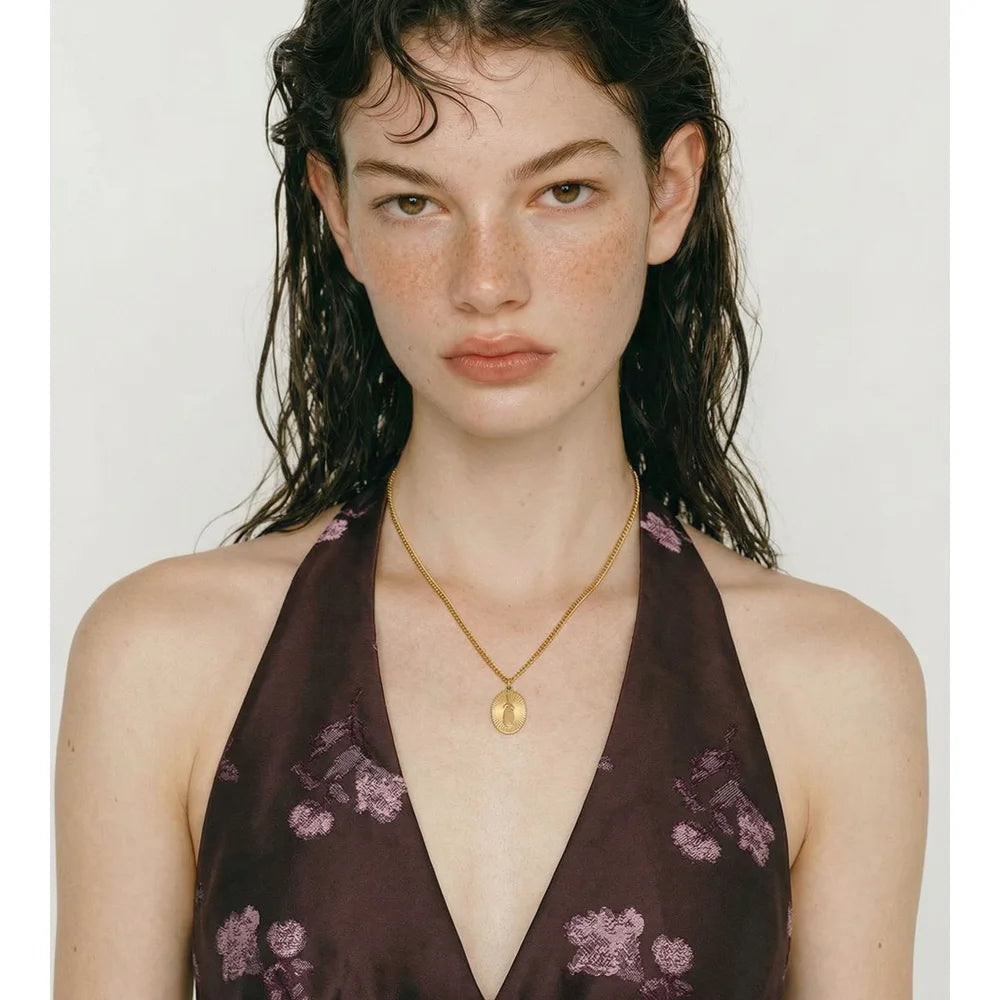 Geometric necklace in gold-plated stainless steel.