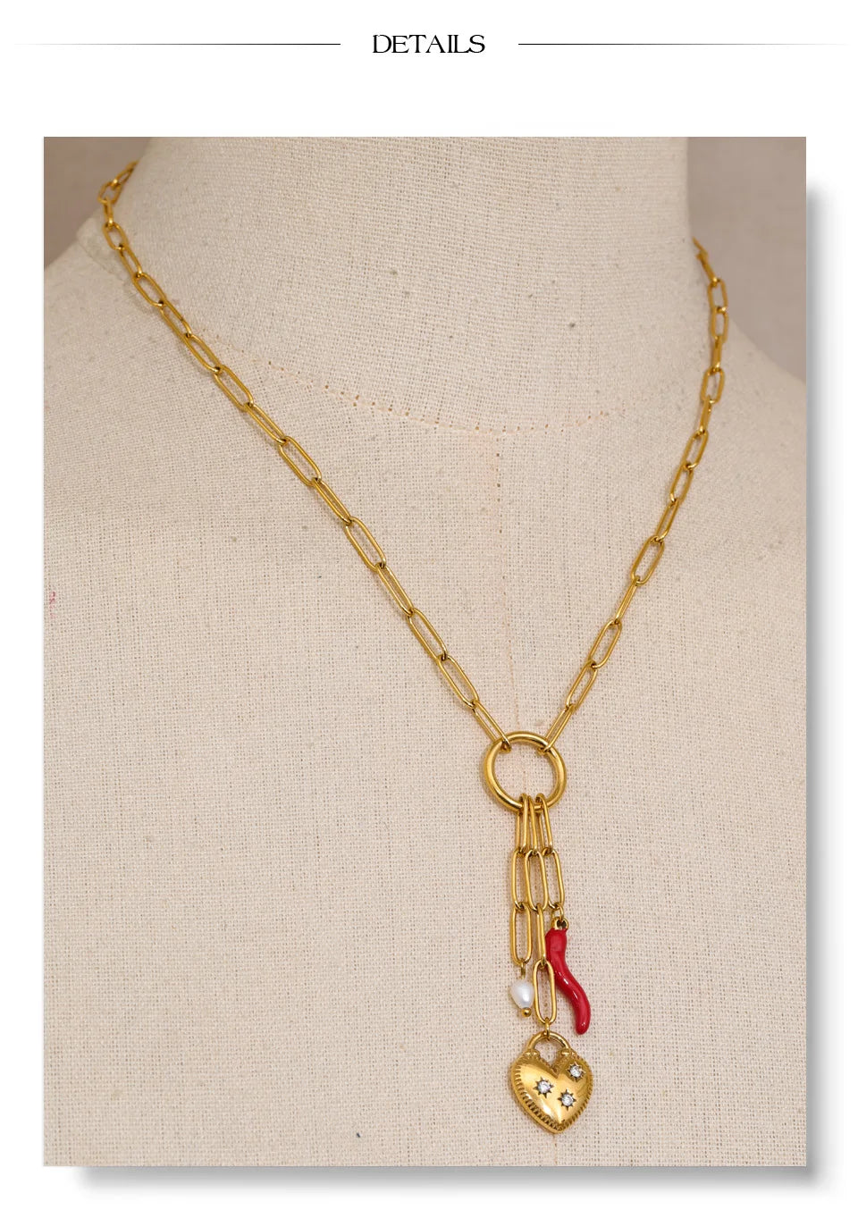Cubic zirconia freshwater pearl heart necklace in gold-plated stainless steel with freshwater pearl and cubic zirconia.