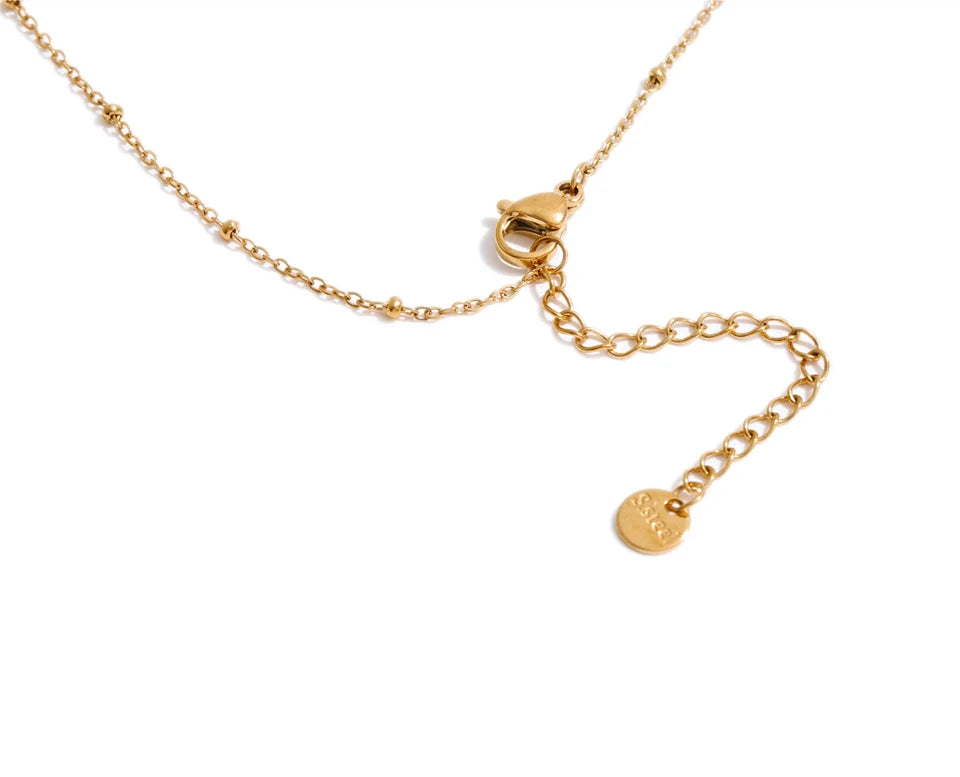 Cubic zirconia geometric necklace in gold-plated stainless steel with cubic zirconia.