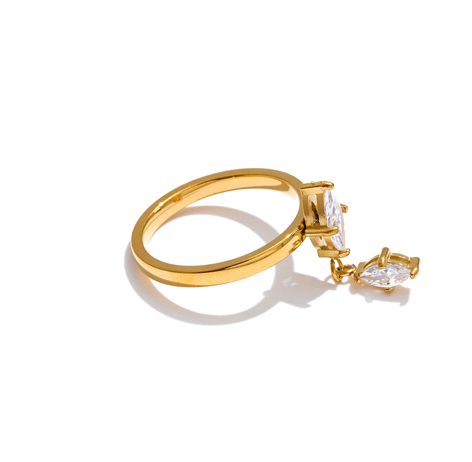 Cubic zirconia geometric ring in 18K gold-plated stainless steel with cubic zirconia.