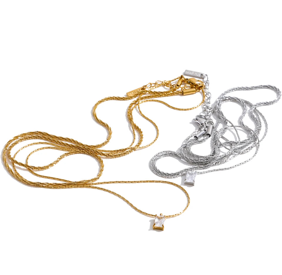 Cubic zirconia geometric chain necklace in gold-plated stainless steel with cubic zirconia.
