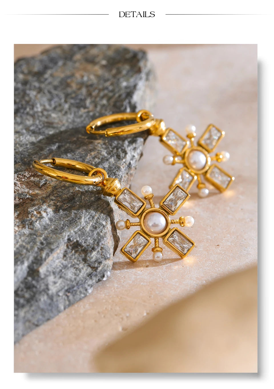 Cubic zirconia pearl cross earrings in gold-plated stainless steel with pearl and cubic zirconia.