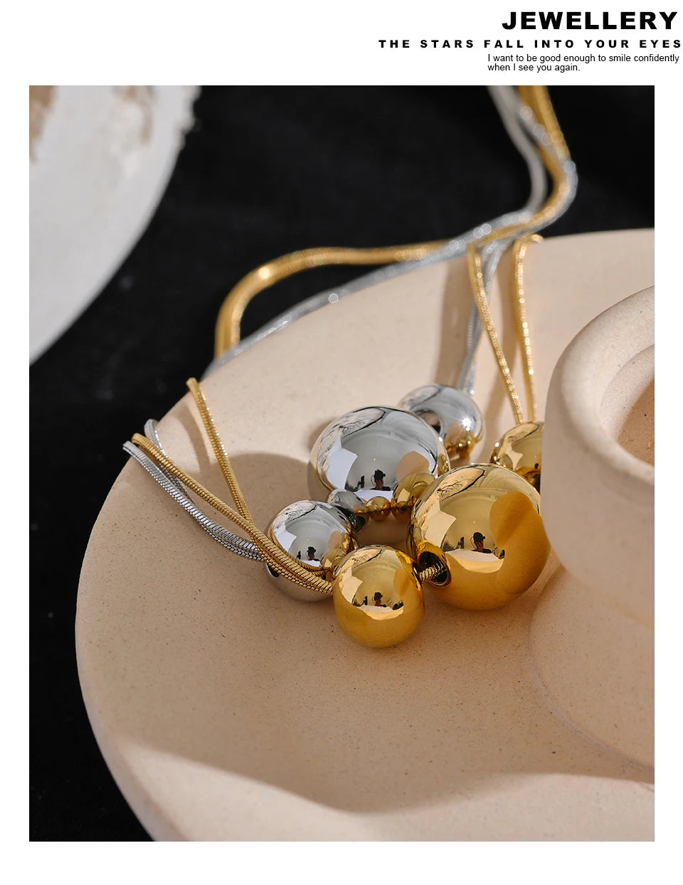 Beaded geometric chain necklace in gold-plated 316L stainless steel.