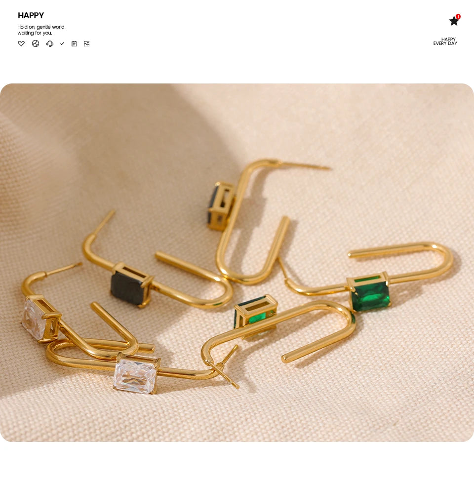 Black cubic zirconia geometric earrings in 18K gold-plated stainless steel with cubic zirconia.