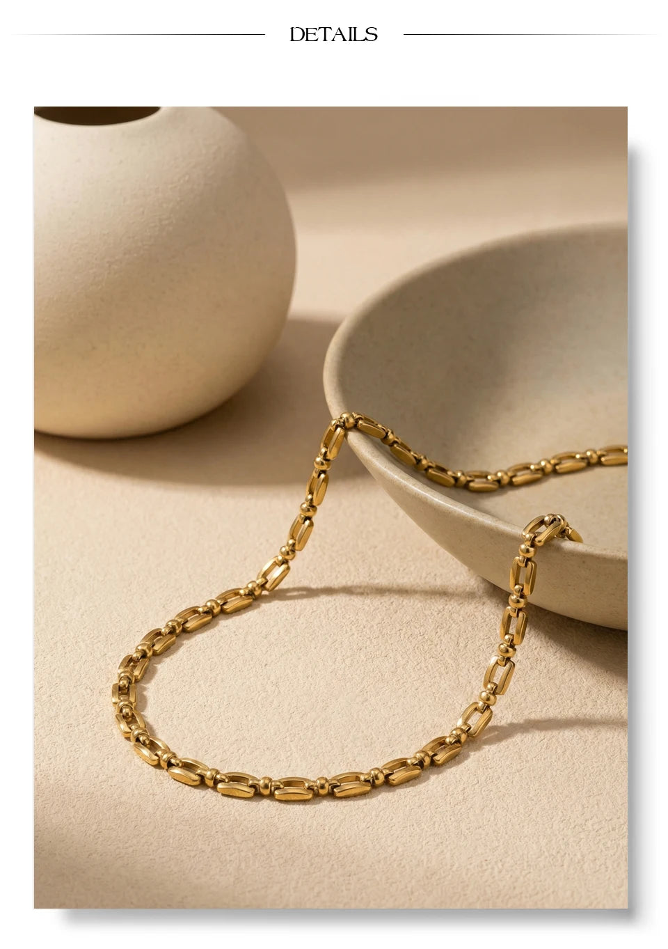 Geometric chain necklace in gold-plated stainless steel.