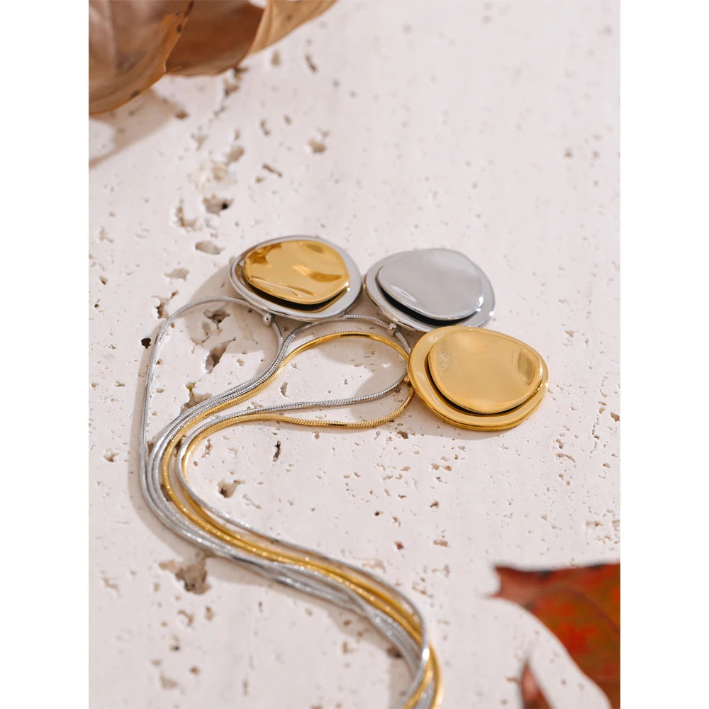 Coin geometric necklace in gold-plated stainless steel.