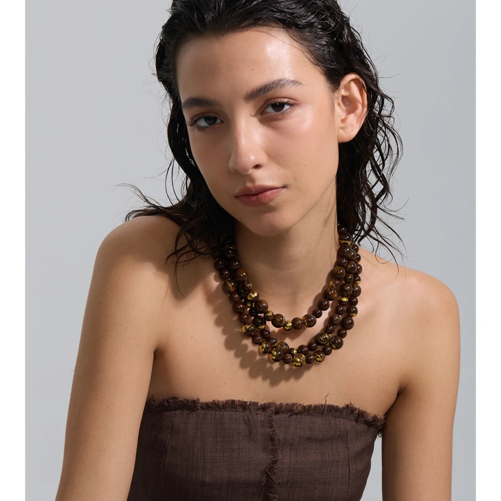 Pearl beaded geometric earrings in gold-plated stainless steel with pearl.