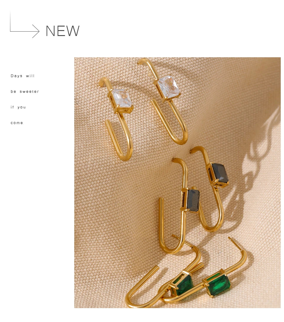 Black cubic zirconia geometric earrings in 18K gold-plated stainless steel with cubic zirconia.