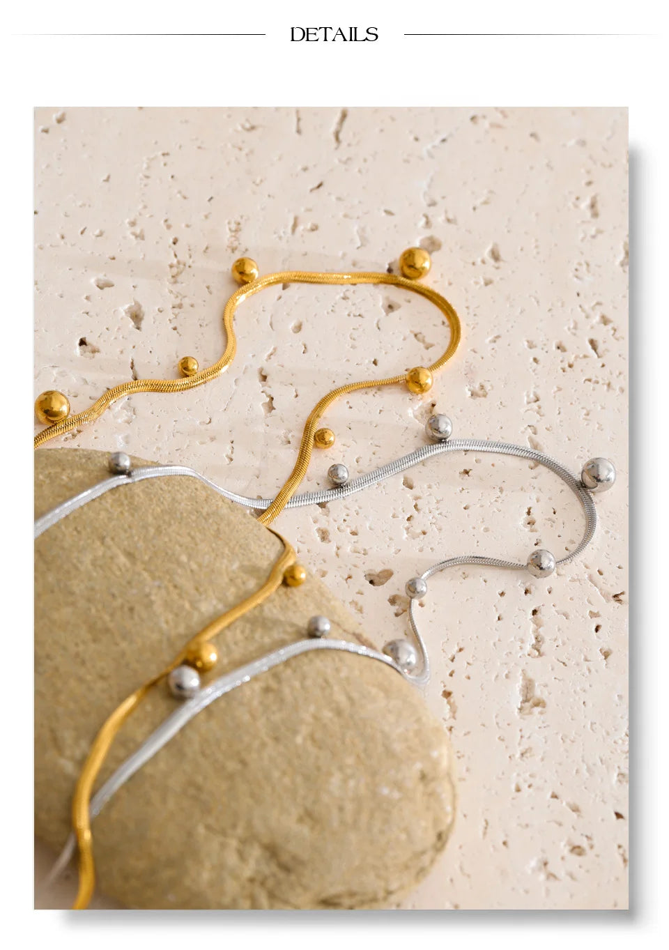Beaded geometric chain necklace in gold-plated stainless steel.