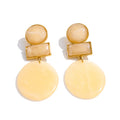 Resin geometric earrings in gold-plated stainless steel with resin.