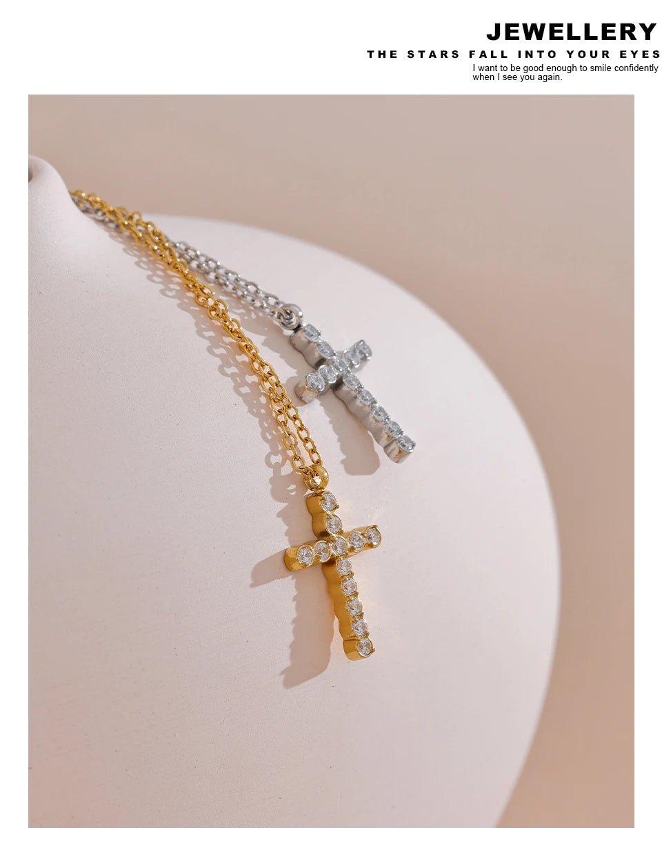Cubic zirconia cross necklace in gold-plated 316L stainless steel with cubic zirconia.