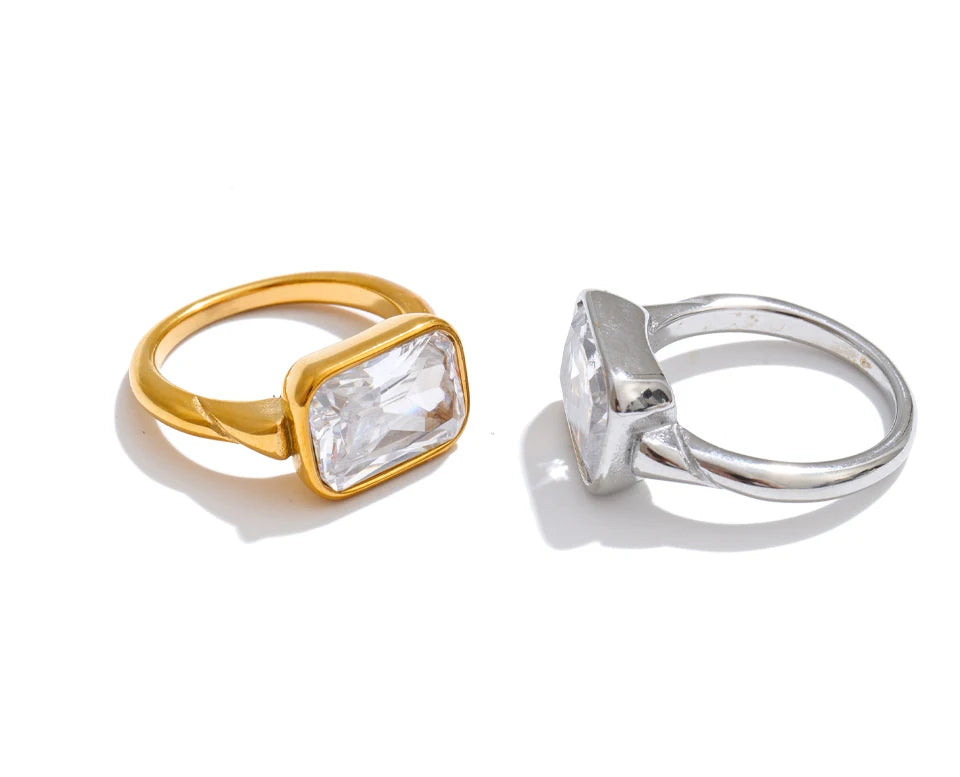 Cubic zirconia geometric ring in 18K gold-plated stainless steel with cubic zirconia.