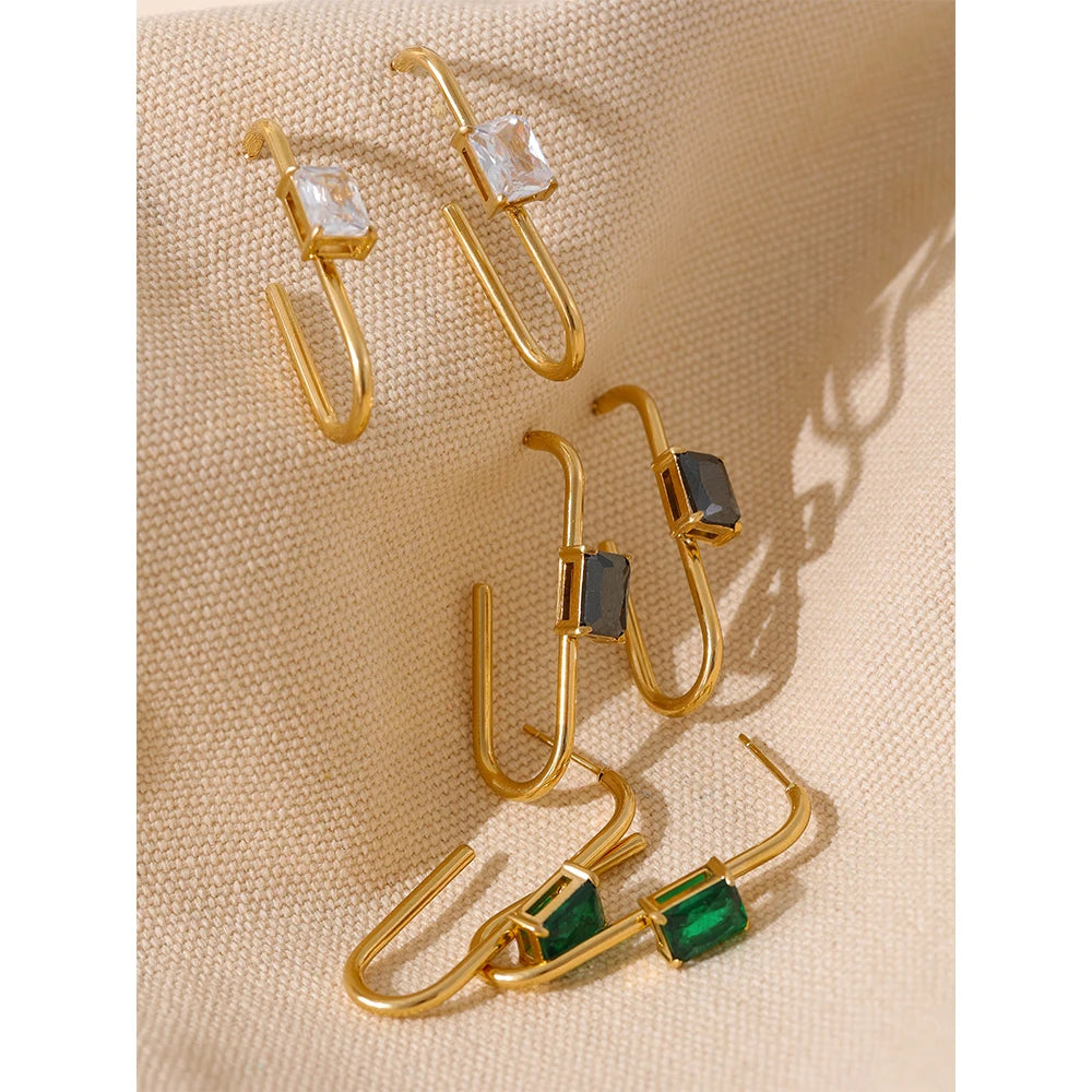 Black cubic zirconia geometric earrings in 18K gold-plated stainless steel with cubic zirconia.