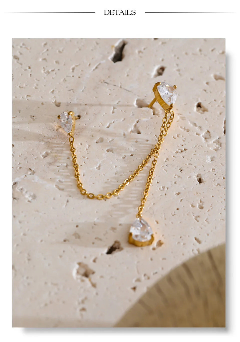 Cubic zirconia chain earrings in gold-plated stainless steel with cubic zirconia.