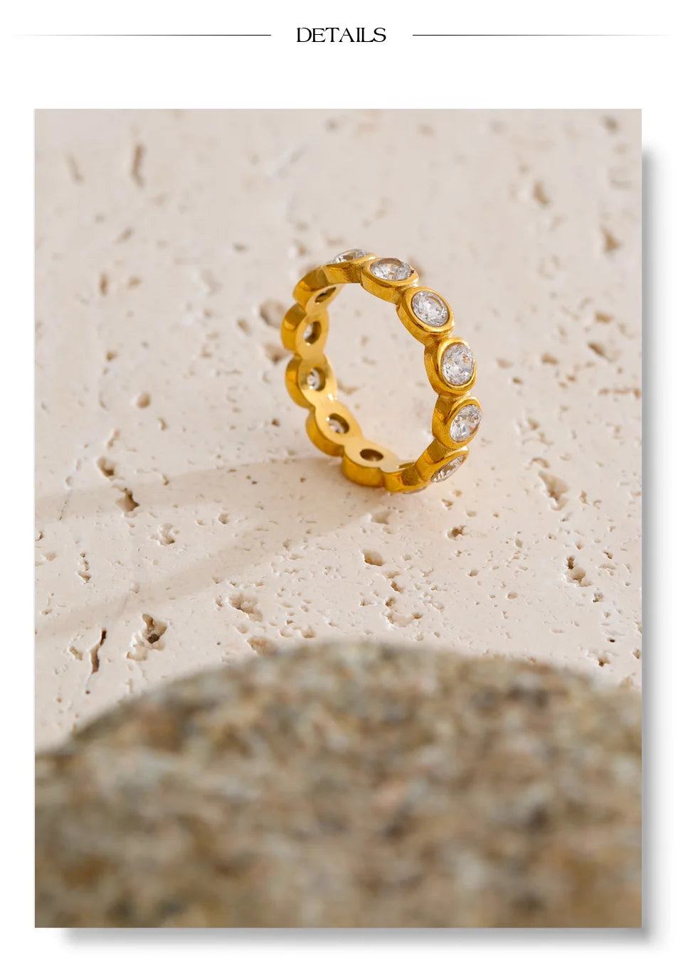 Cubic zirconia geometric ring in 18K gold-plated stainless steel with cubic zirconia.