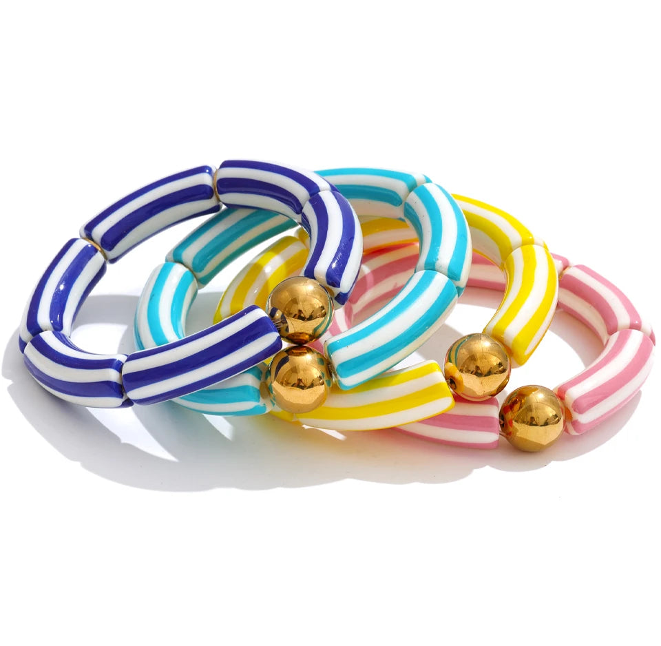 Resin acrylic multi-color bracelet in gold-plated stainless steel with resin and acrylic.