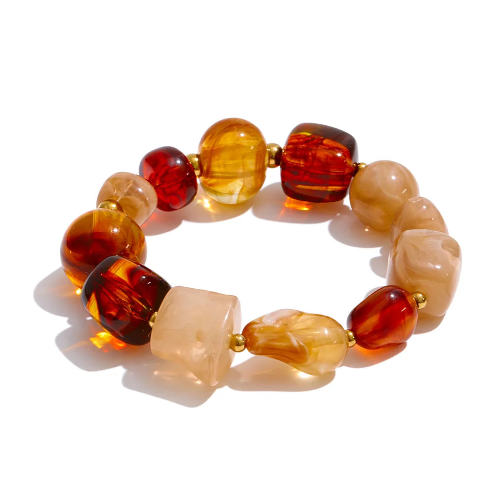 Resin acrylic beaded necklace in gold-plated stainless steel with resin and acrylic.