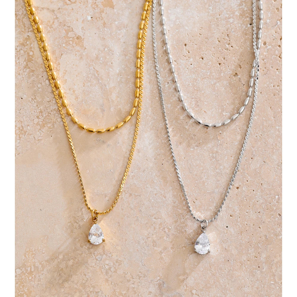 Cubic zirconia geometric layered necklace in gold-plated stainless steel with cubic zirconia.