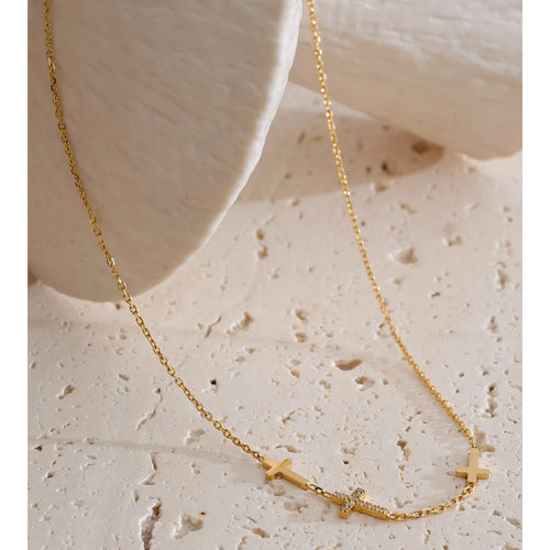Cubic zirconia cross geometric necklace in gold-plated stainless steel with cubic zirconia.