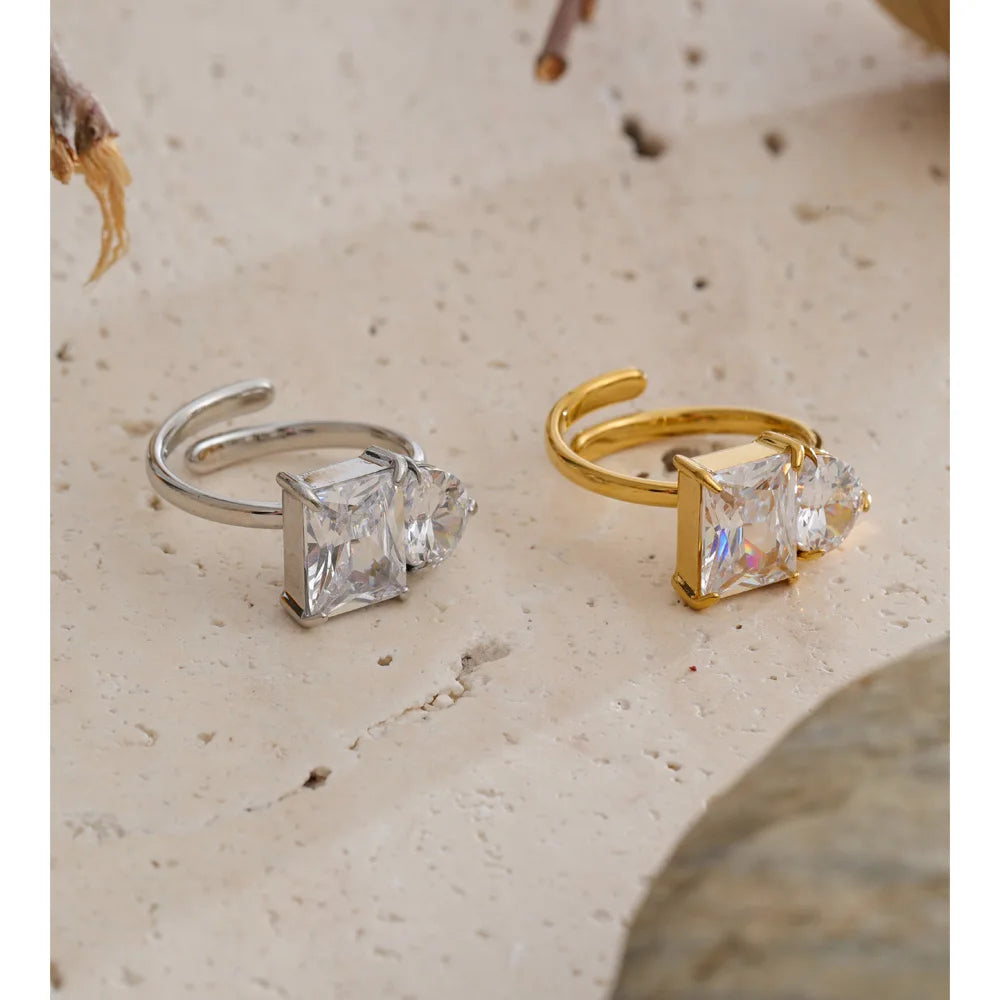 Cubic zirconia geometric ring in 18K gold-plated stainless steel with cubic zirconia.