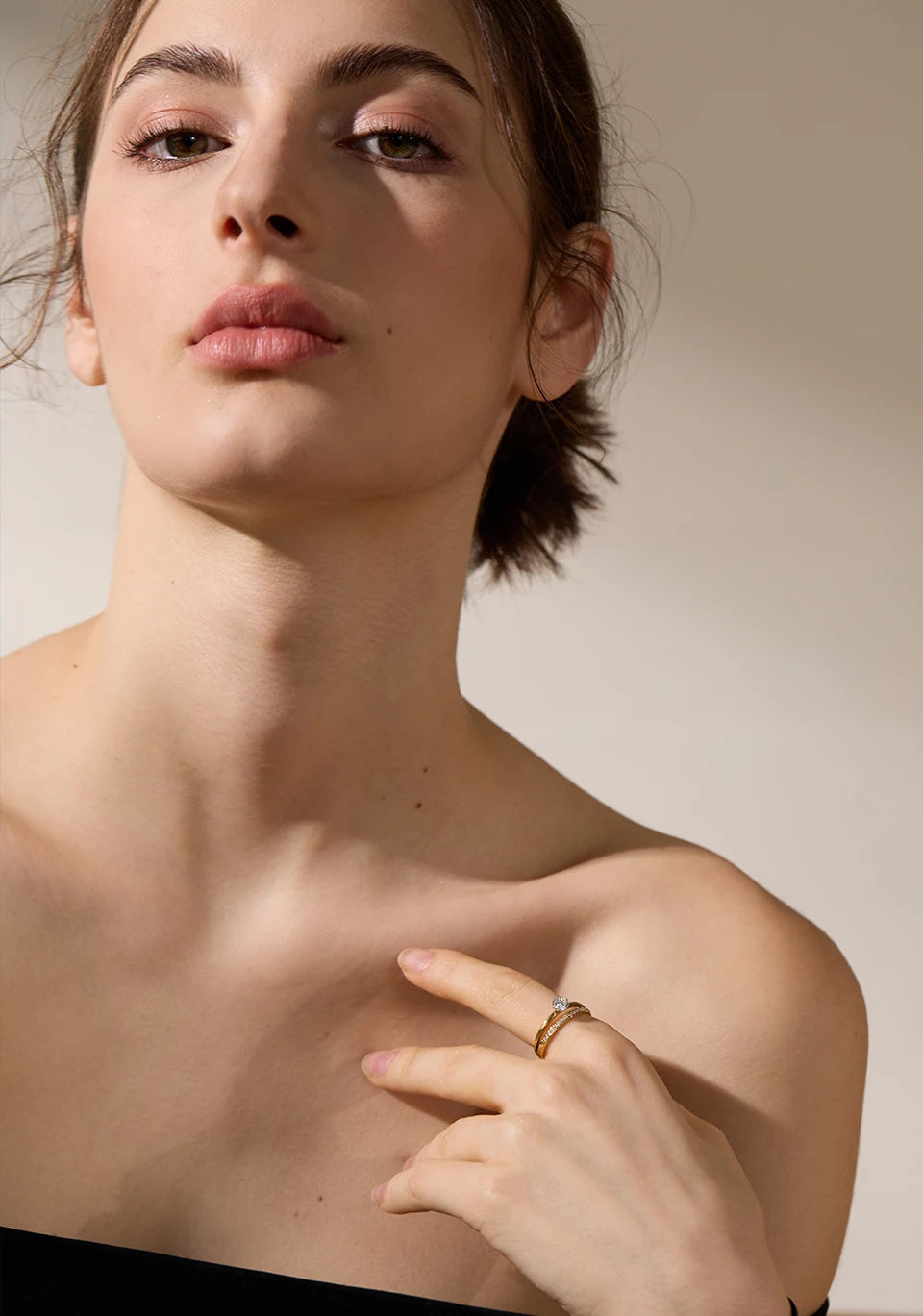 Cubic zirconia geometric layered ring in gold-plated stainless steel with cubic zirconia.