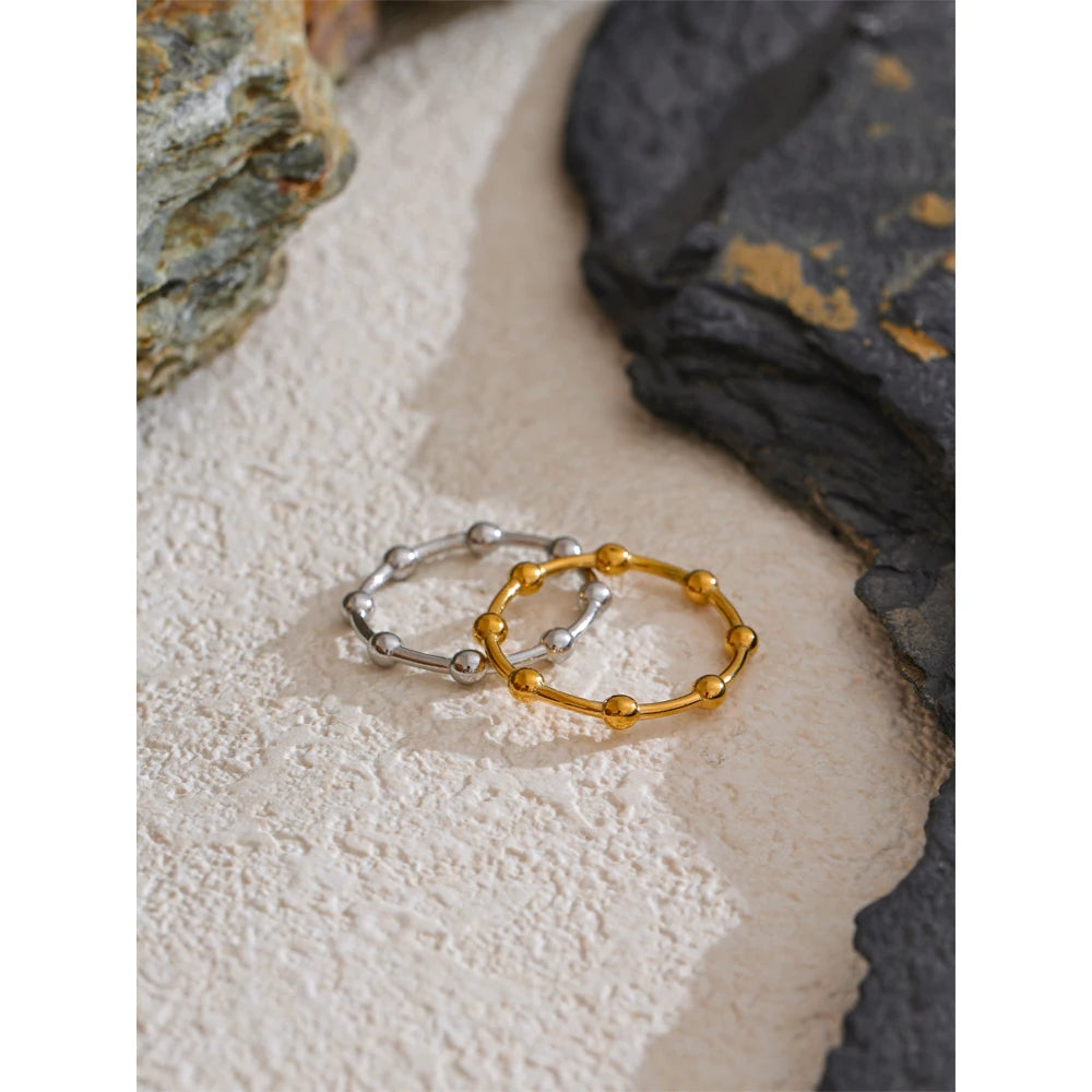 Beaded minimalist geometric ring in 18K gold-plated stainless steel.