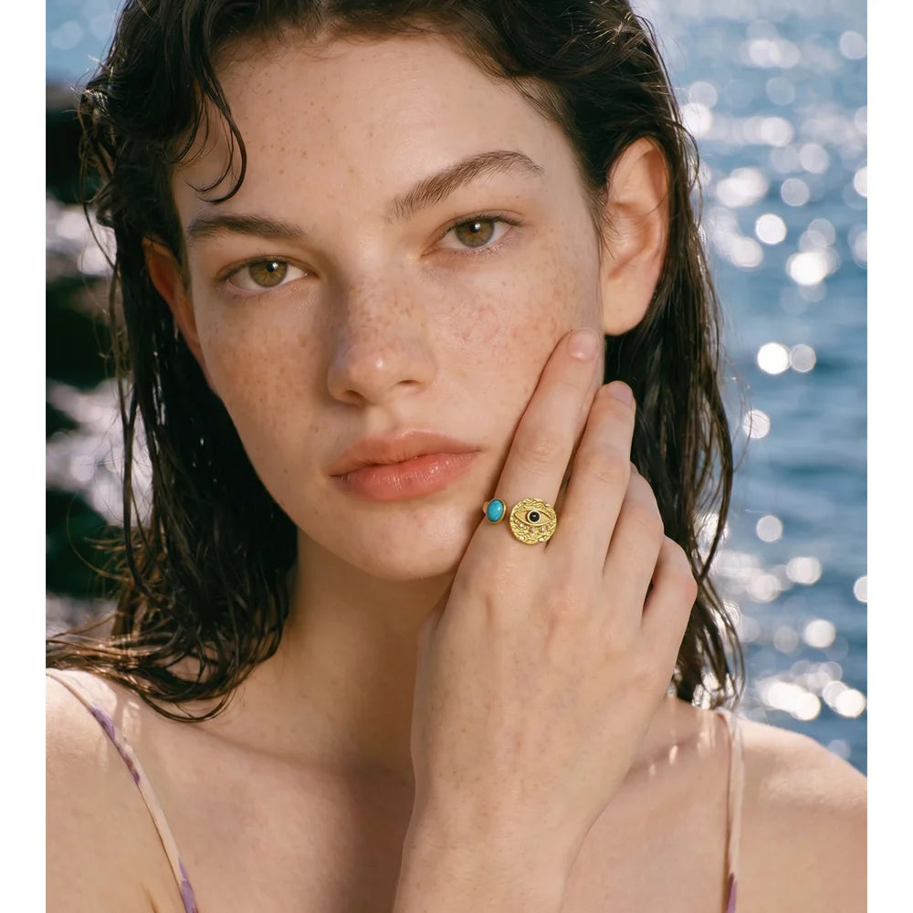 Cubic zirconia natural stone geometric ring in 18K gold-plated stainless steel with cubic zirconia and natural stone.