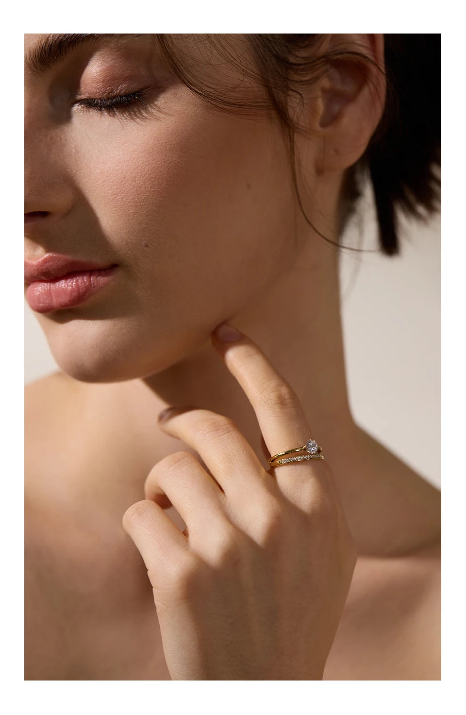 Cubic zirconia geometric layered ring in gold-plated stainless steel with cubic zirconia.