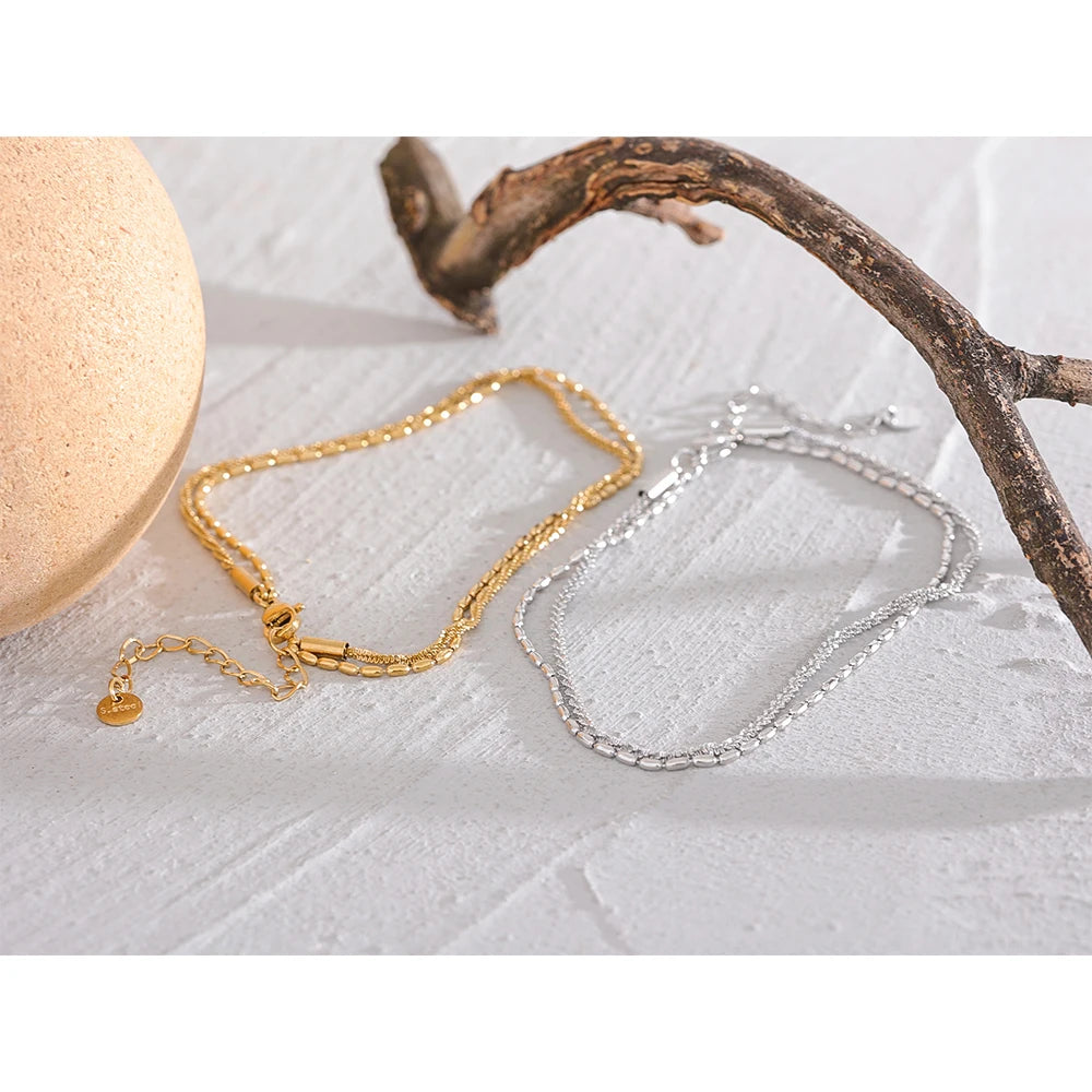Geometric chain layered necklace in gold-plated stainless steel.