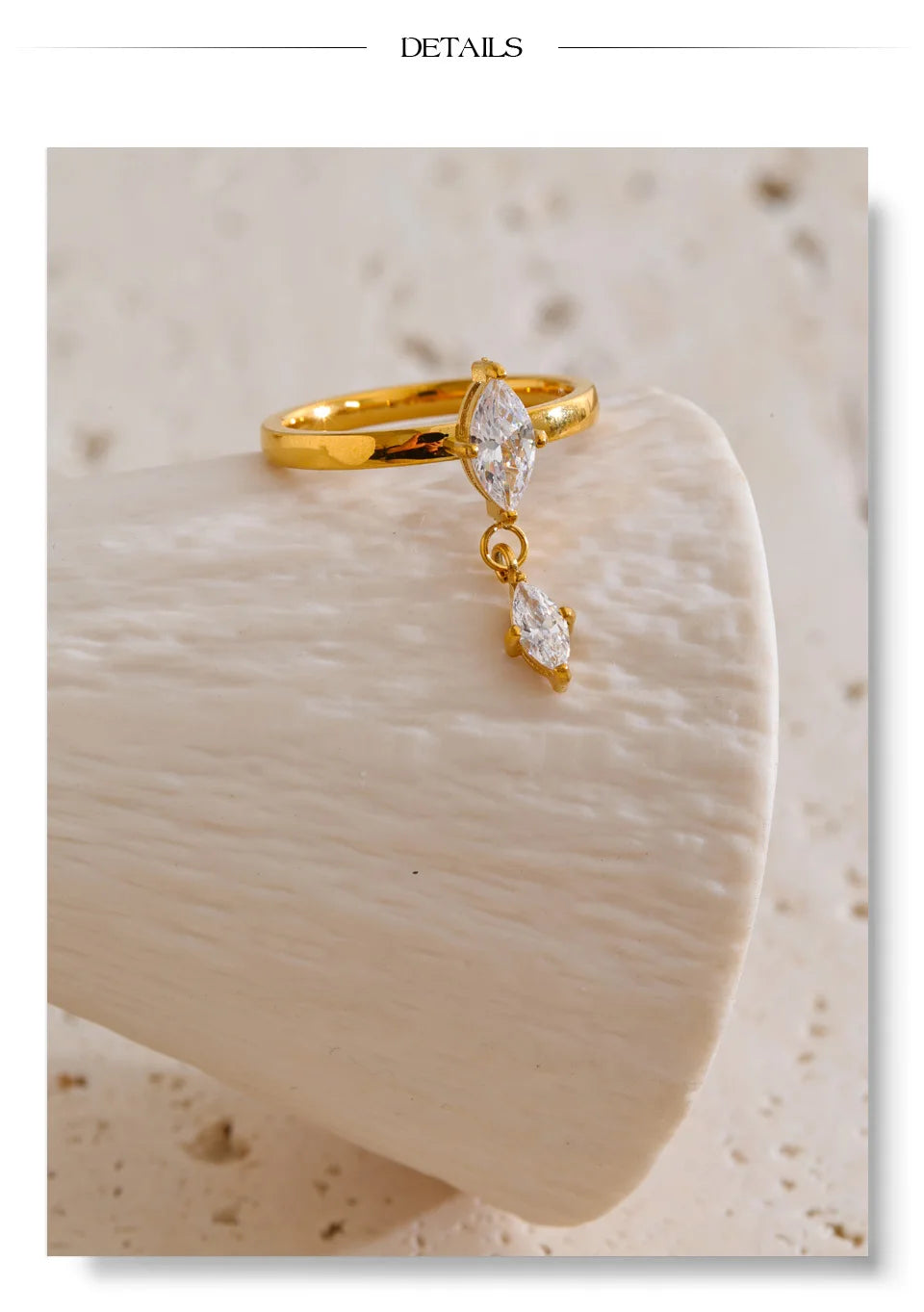 Cubic zirconia geometric ring in 18K gold-plated stainless steel with cubic zirconia.