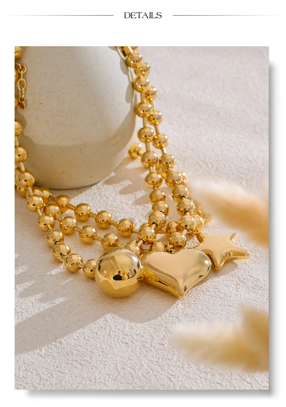 Heart star beaded necklace in gold-plated stainless steel.