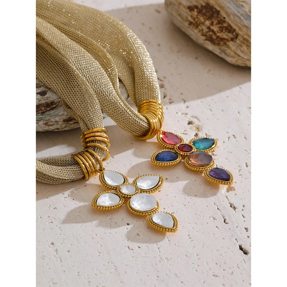 White glass cross necklace in gold-plated stainless steel.