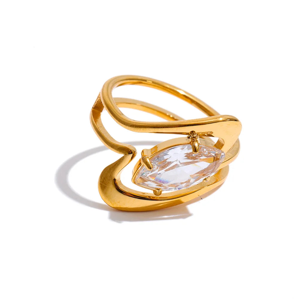 Cubic zirconia geometric ring in 18K gold-plated stainless steel with cubic zirconia.