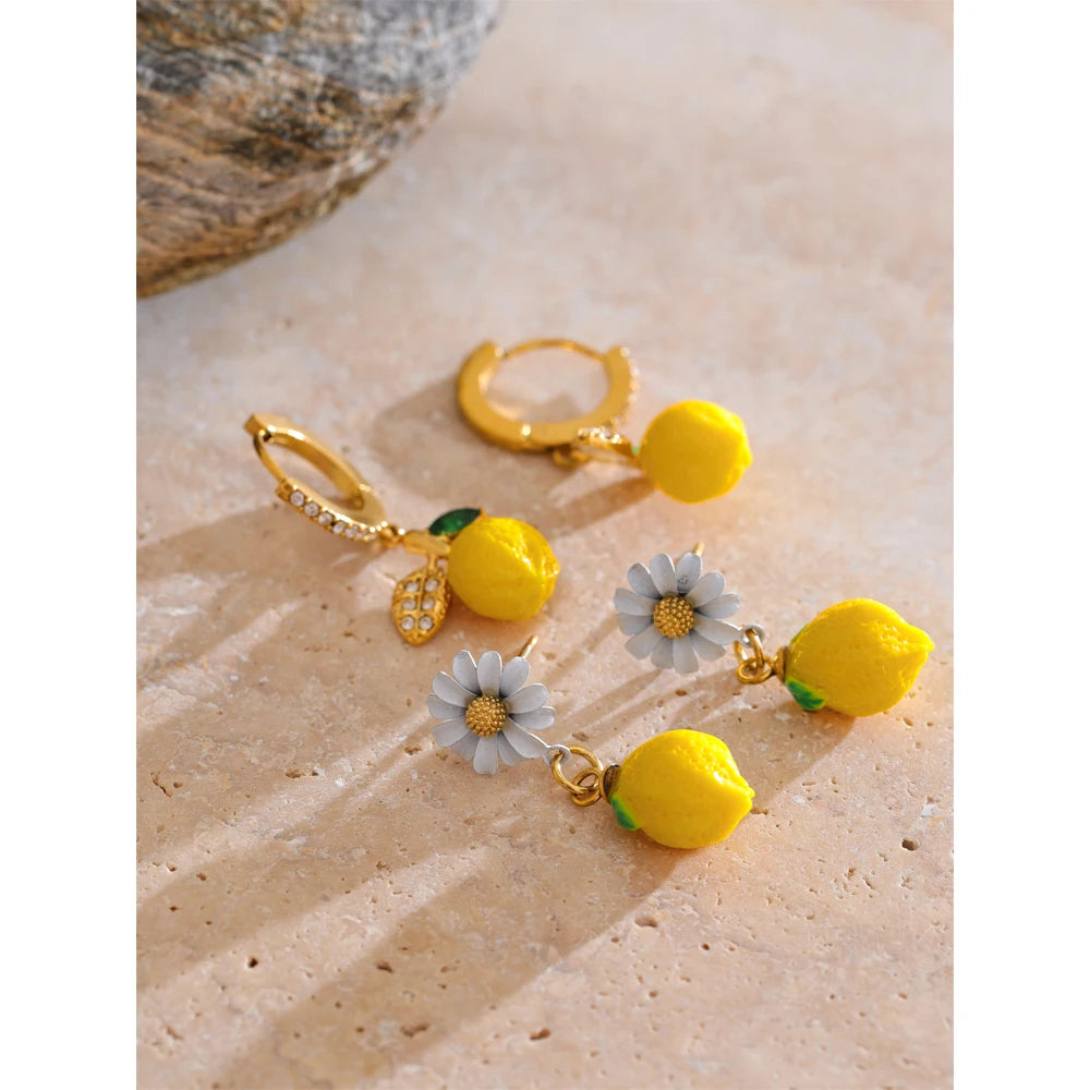 Cubic zirconia resin geometric earrings in gold-plated stainless steel with cubic zirconia and resin.