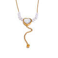 Pearl natural stone heart necklace in gold-plated stainless steel with pearl and natural stone.