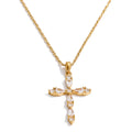 Cubic zirconia cross necklace in gold-plated stainless steel with cubic zirconia.